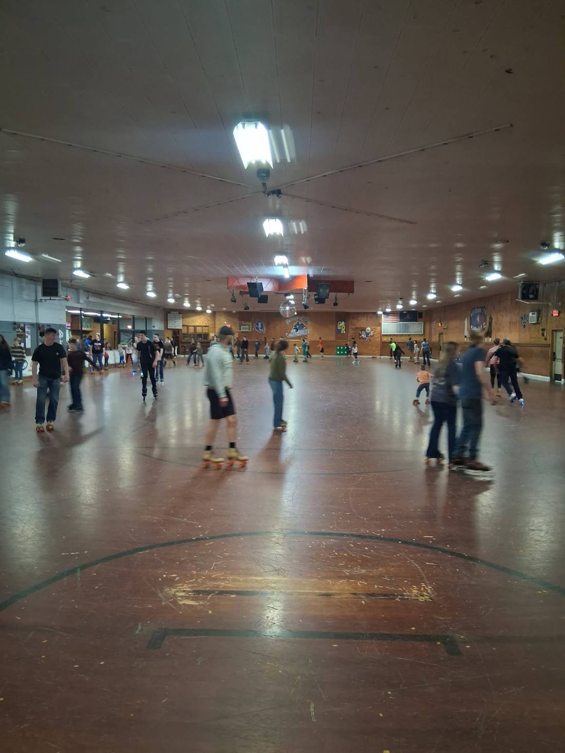 Young people skating at a roller rink during a Royal Rangers skating party
